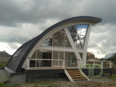 Дерев'яні будинки з оциліндрованих колод.