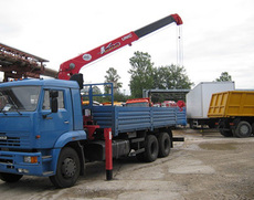 Оренда крана маніпулятора перевезти битовку негабарит Київ.