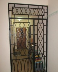 Двери металлические решетчатые